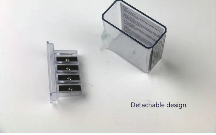Four-hole plastic pencil sharpener with geometric boxed design and screwdriver