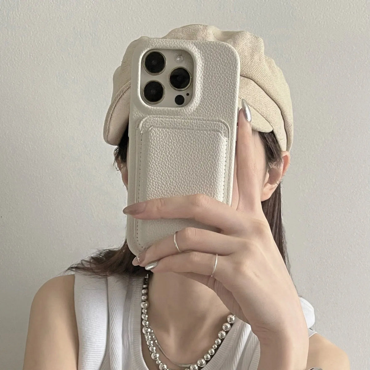 Beige genuine leather phone case with litchi texture for iPhone models 12 to 15 series