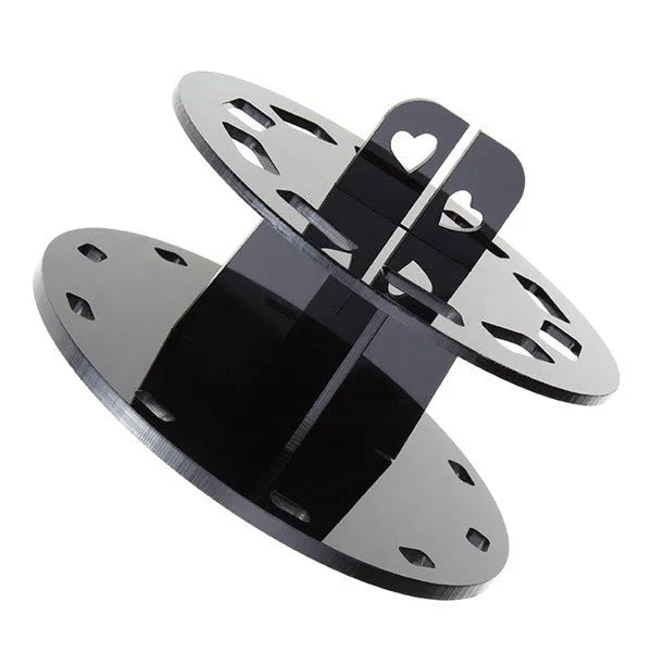 Round black plastic makeup brush holder with 10 holes for storing brushes upright on a vanity or bathroom counter