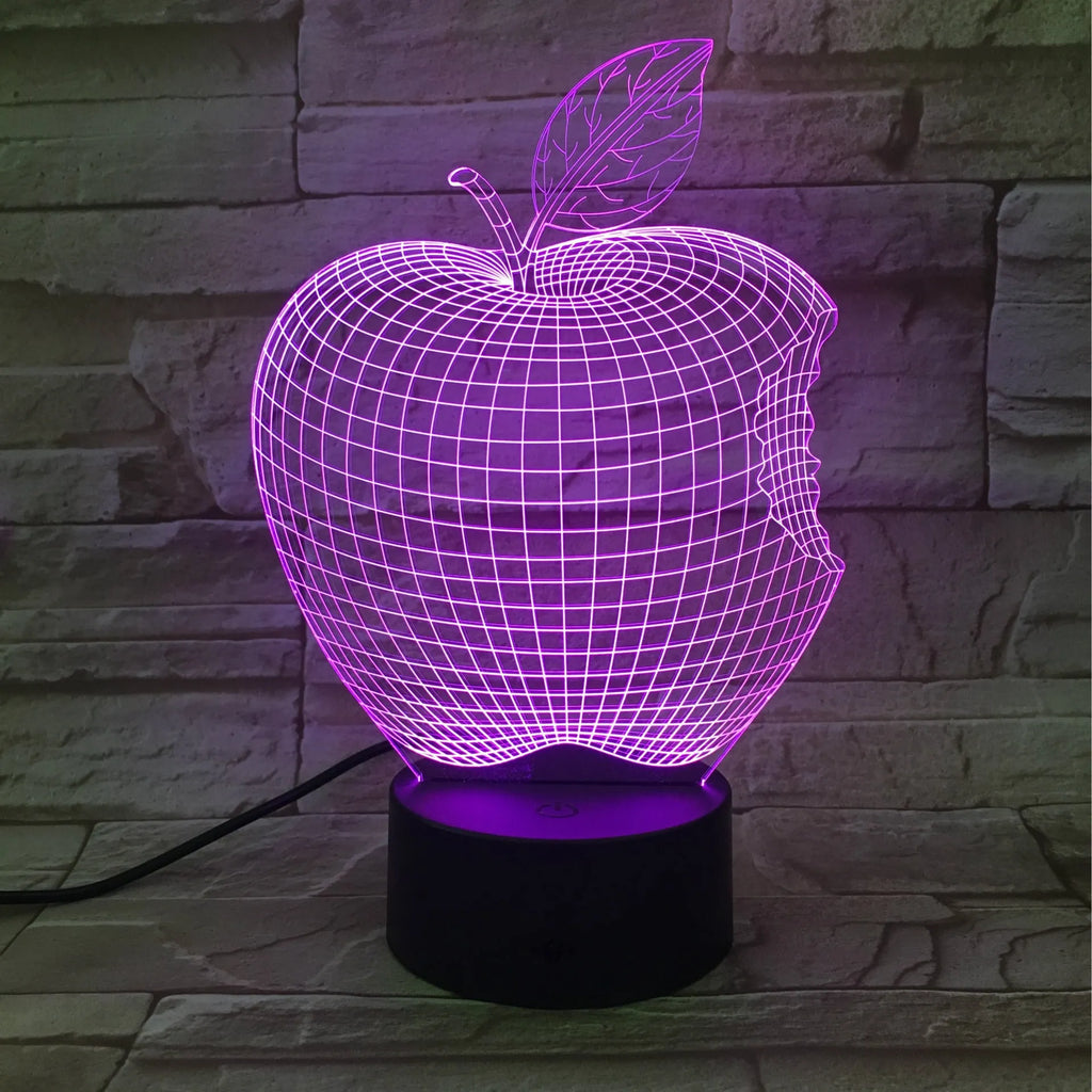 3D acrylic fruit-shaped night light with touch control and multi-colour LED illumination on a dark surface.