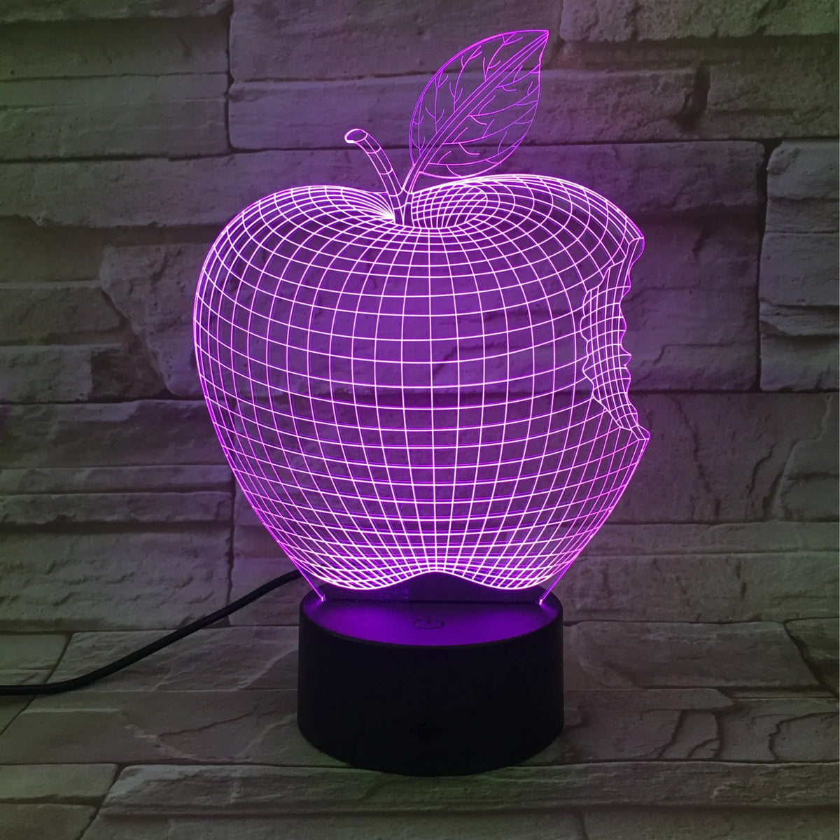 3D acrylic fruit-shaped night light with touch control and multi-colour LED illumination on a dark surface.
