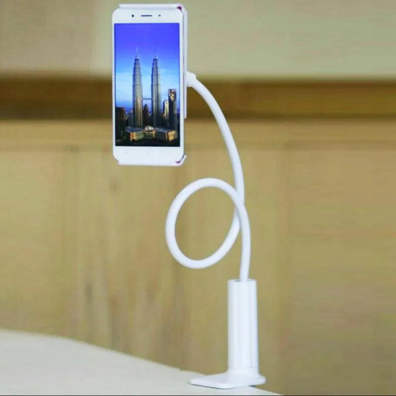 Black aluminium alloy and plastic bedside phone handset with long arm extended on a wooden table.