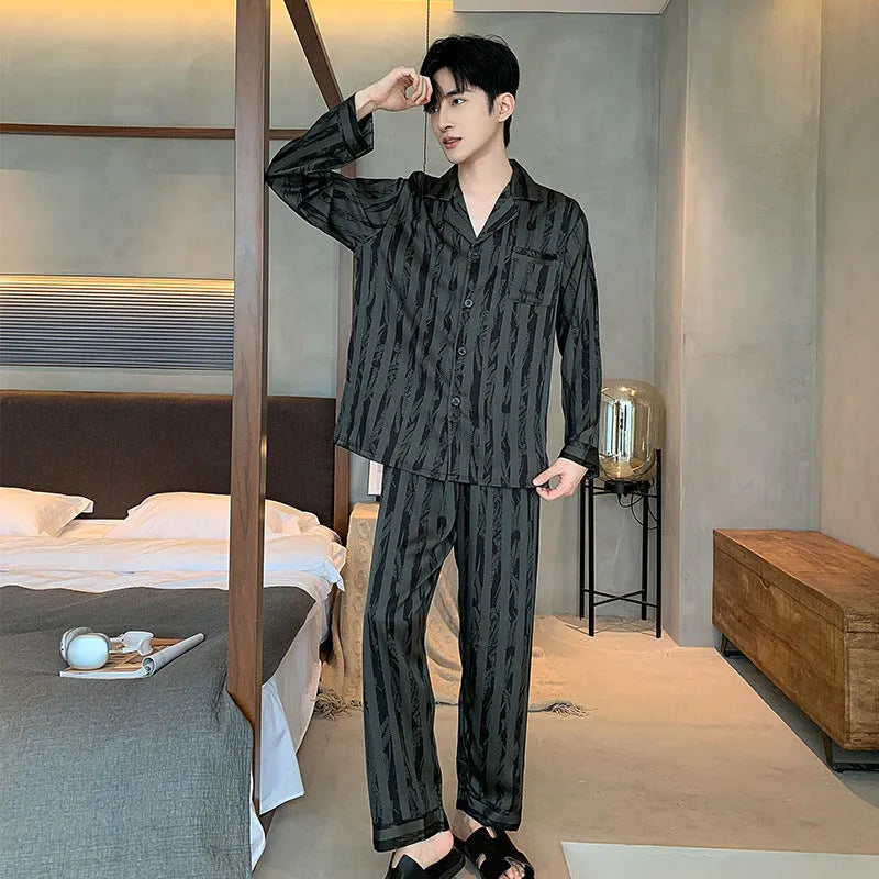 Men's black striped ice silk V-neck pyjama set with long sleeves and trousers.