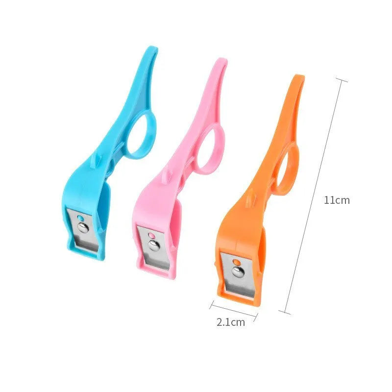 Finger ring peeler with plastic body and stainless steel blade in pink, blue, or orange for scraping fruit and vegetable skin