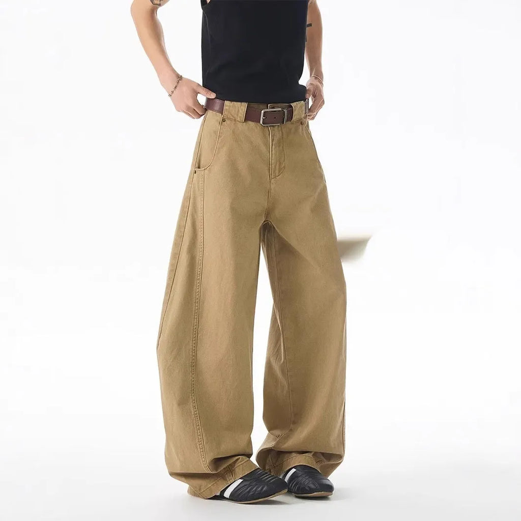 Brown men's loose-fit straight-leg jeans with a button fly and mid-rise waist.