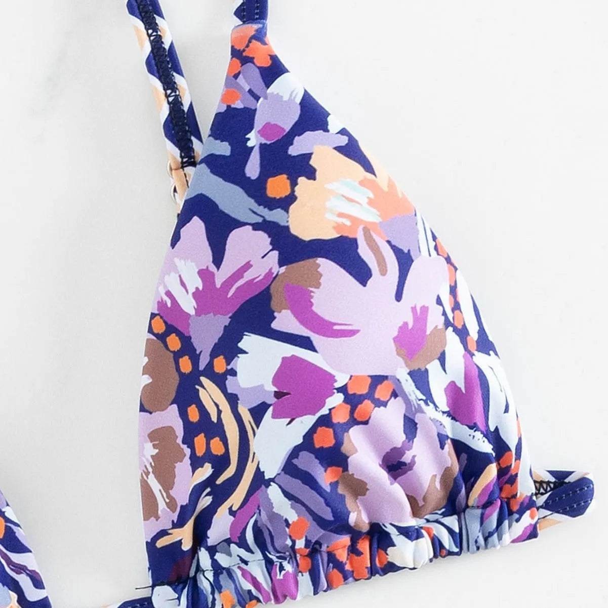 Women's floral print triangle top bikini with briefs bottom on a mannequin