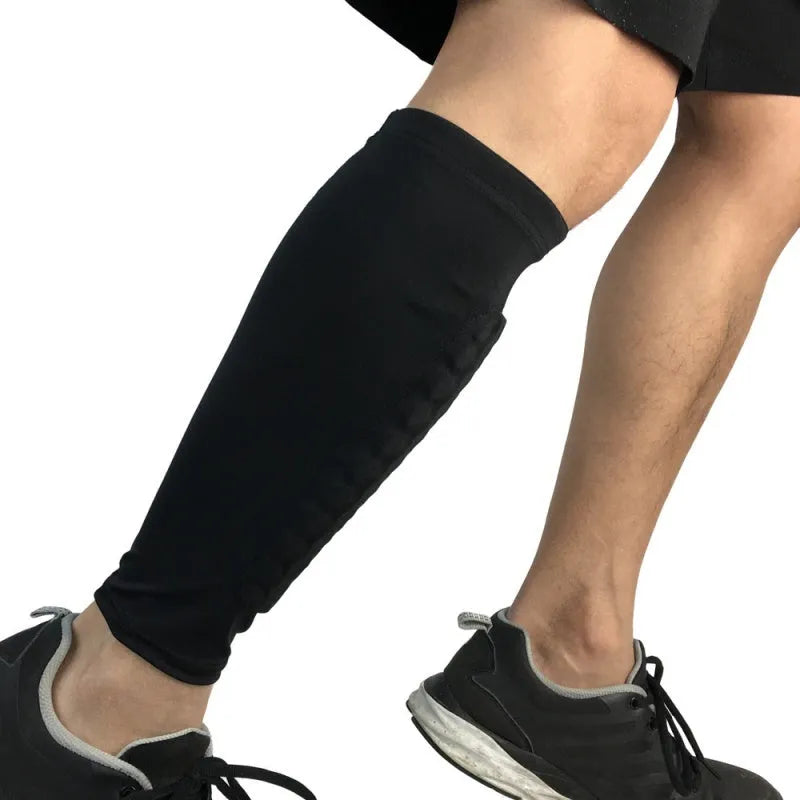 Lycra shin guard leg sleeve with silicone band in black, green or blue, sizes M L XL for football and training