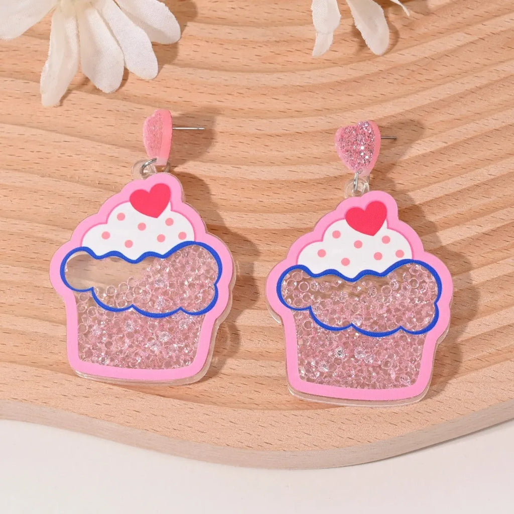 Set of acrylic earrings shaped like cherry, strawberry, watermelon, pineapple, coconut, cake, and ice cream.