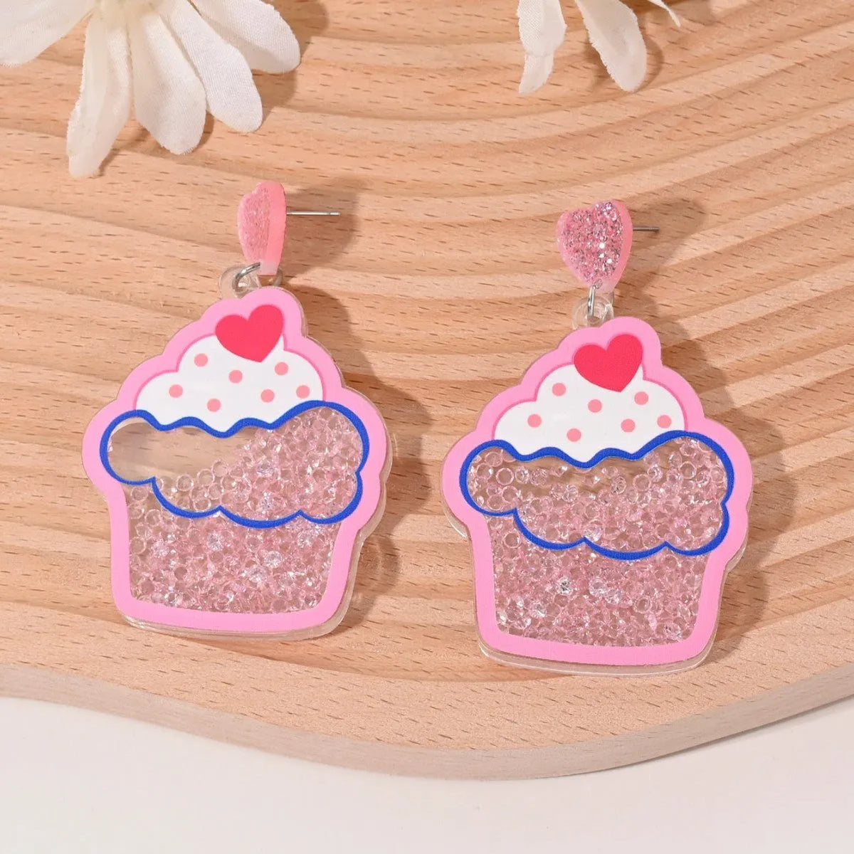 Set of acrylic earrings shaped like cherry, strawberry, watermelon, pineapple, coconut, cake, and ice cream.