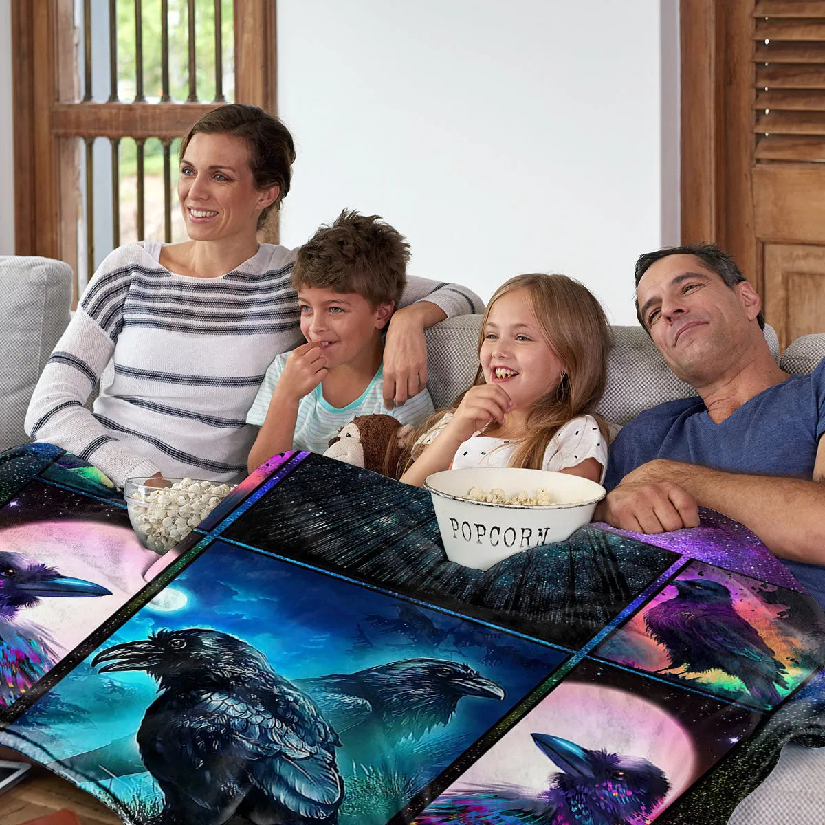Multicoloured Raven print flannel blanket in 75x100cm, 130x150cm, and 150x200cm sizes with hemmed edges