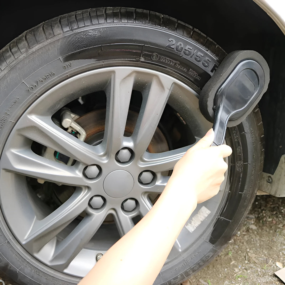 Car tyre waxing long handle sponge brush with polyester sponge head on a grey background