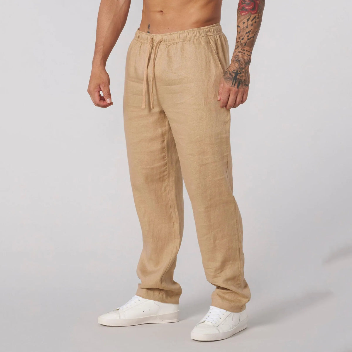 Men's casual sports trousers in polyester, available in white, black, khaki and sky blue, sizes S to XXL, no liner, regular length.