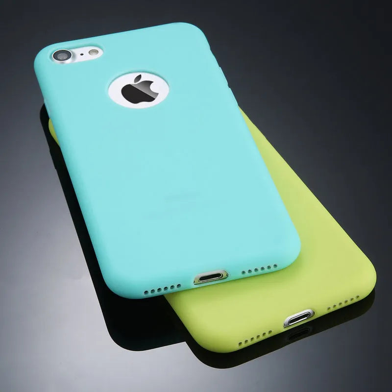 USLION soft silicone TPU phone case in Candy Colours for iPhone models on a table.