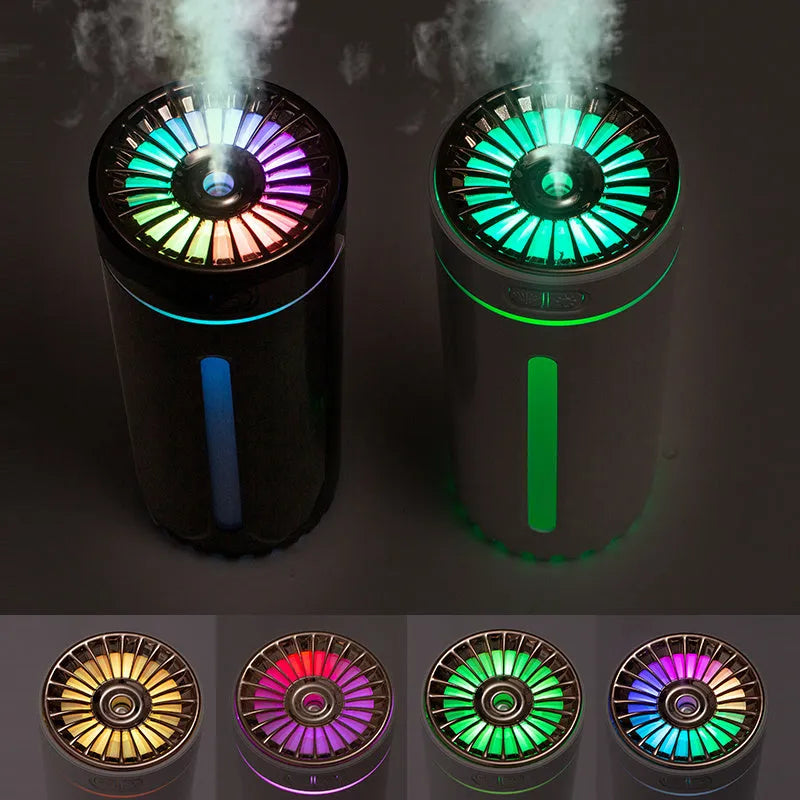 Black and white portable wireless humidifier with LED lights on a car cup holder and desktop
