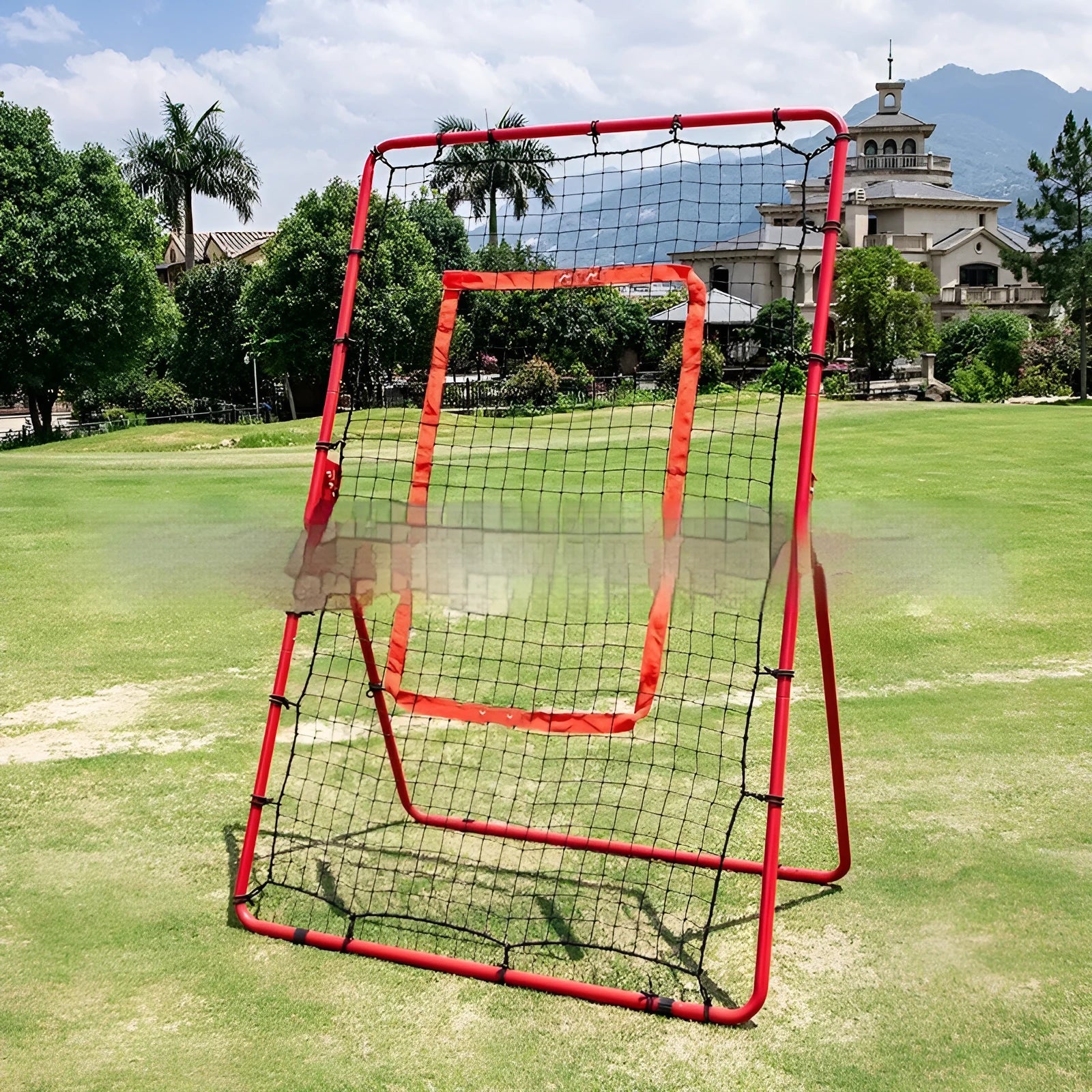 Red portable baseball training net with metal frame set up in outdoor practice area