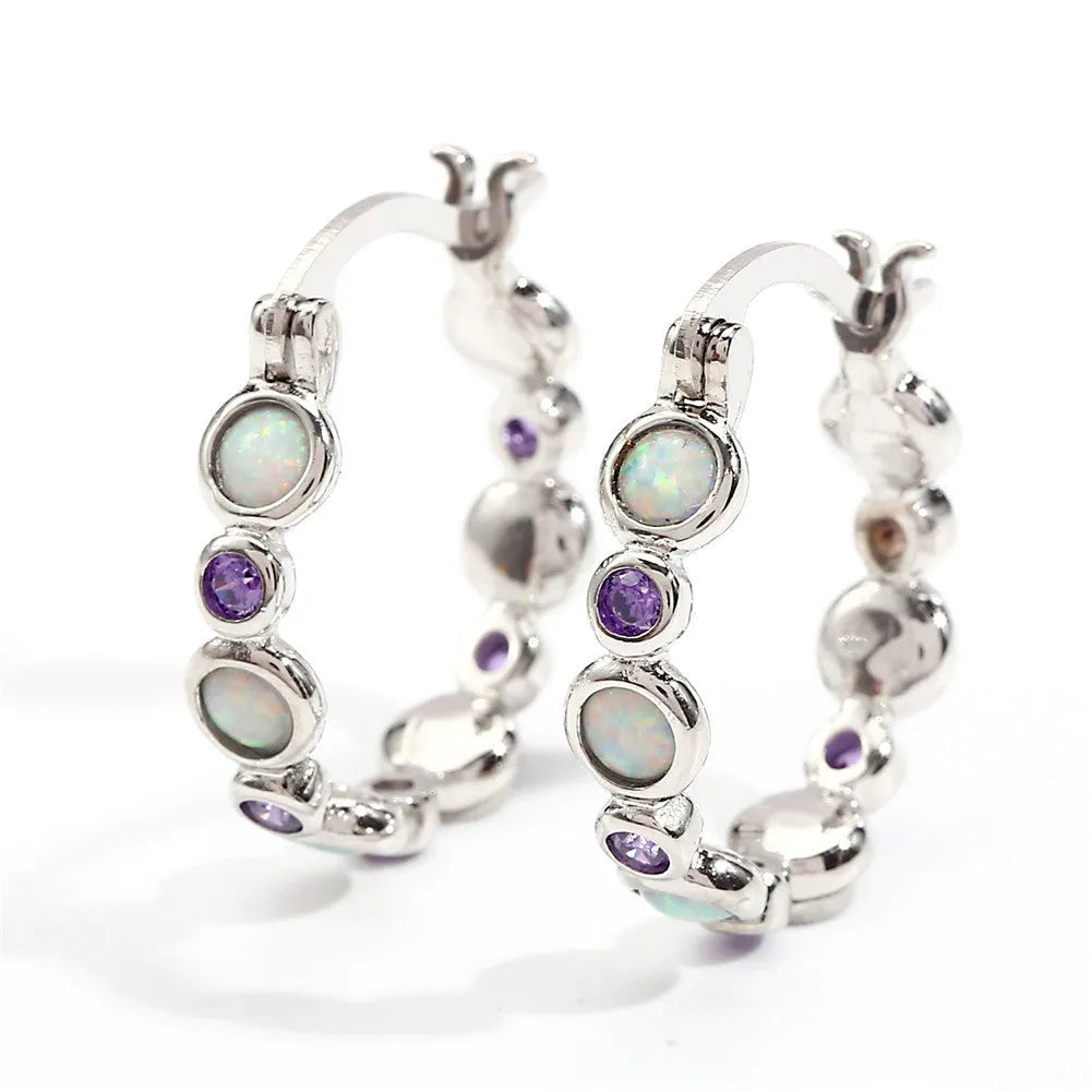 Round copper earrings with synthetic opal and cubic zirconia in platinum white finish