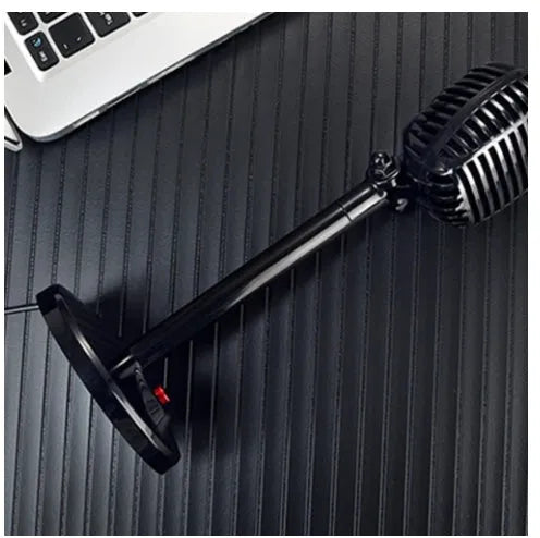 Black USB computer microphone on a weighted stand with an adjustable neck and long cable.