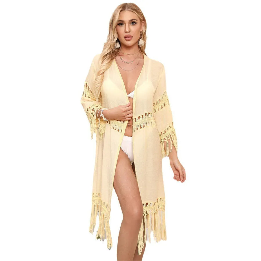 Women's loose-fit acrylic crochet cardigan with tassel stitching, shown in water green, for beach cover-up.