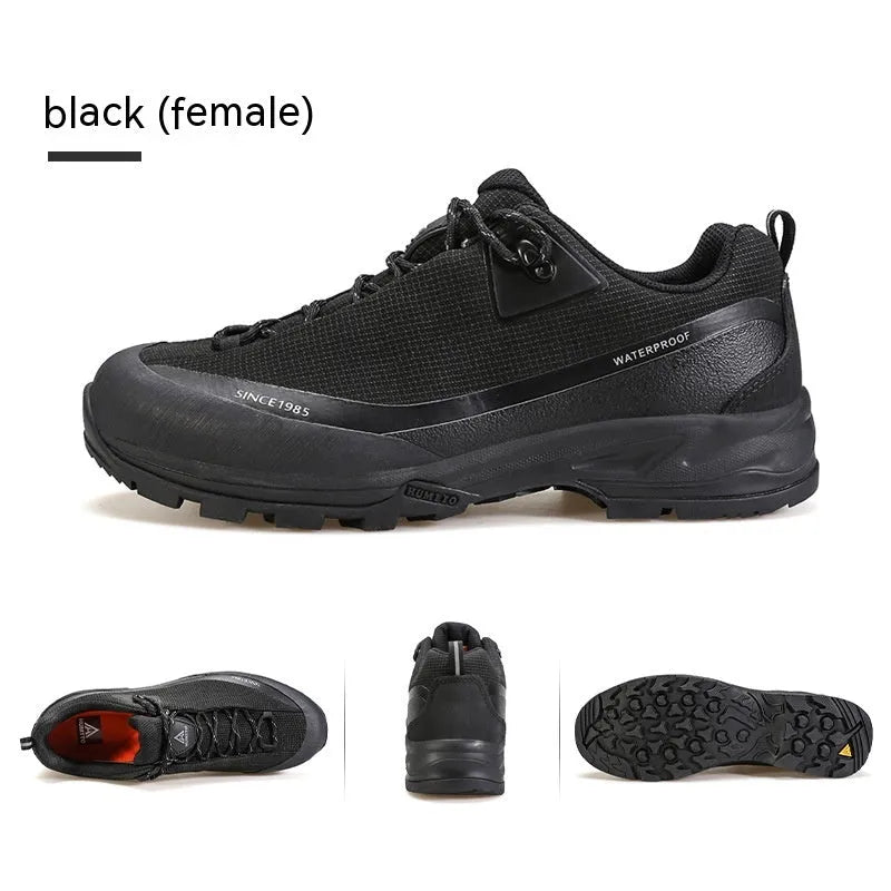 Men's low-top mountain climbing shoes in black with leather mesh upper and non-slip rubber outsole