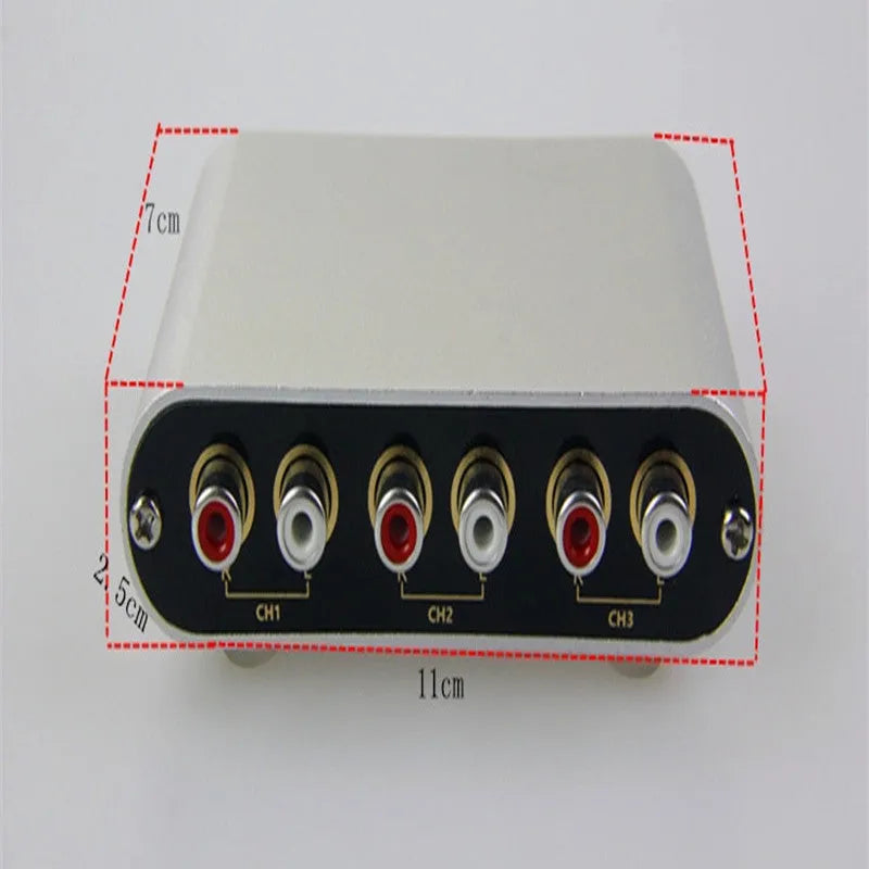 Silver aluminium alloy audio source selector switch unit with front-panel buttons and infrared remote.