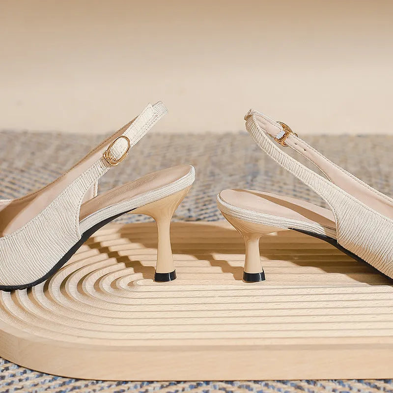 Women's stiletto slingback sandals in black or apricot with 5cm or 7cm heel, cloth upper and rubber sole.