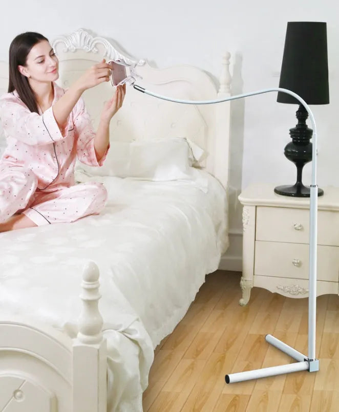 Adjustable bedside mobile phone holder bracket in black or white with universal clamp and folding mount