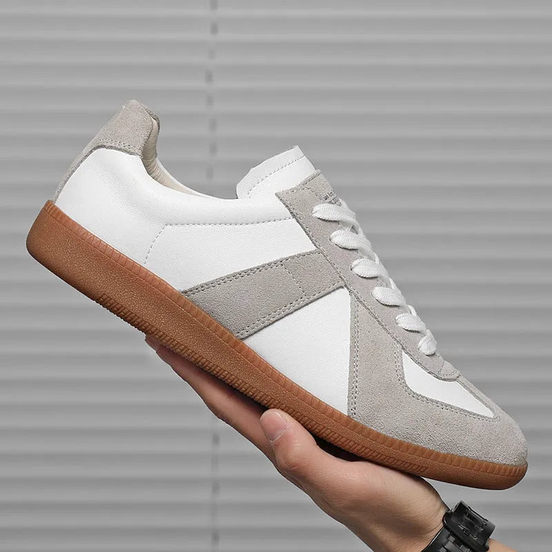 White Japanese-style retro low-top sneakers with matte upper and lace-up front