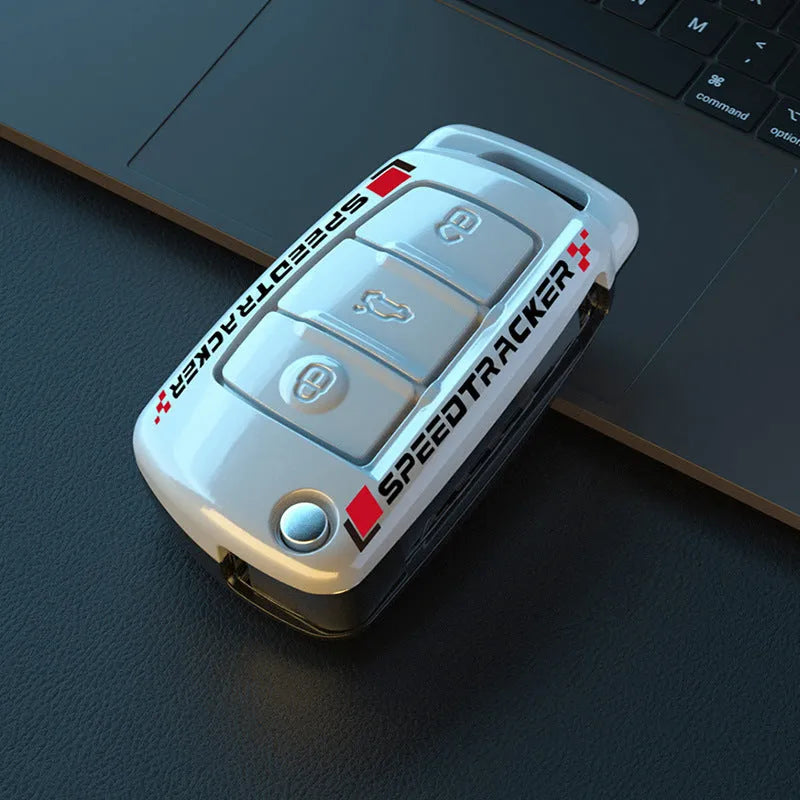 Carbon fibre style car key cover with mirror elements in carbon and white colours