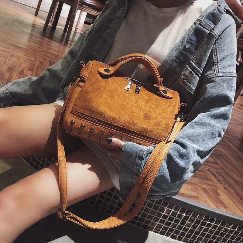 Soft PU leather women's tote shoulder bag in black, shown with smooth zipper and large main compartment.
