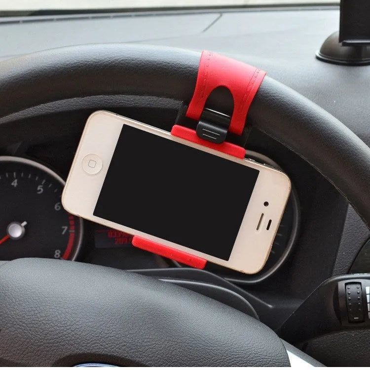 Black steering wheel phone clip mount holding smartphone with soft silicone padding visible