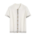 White women's short sleeve cardigan with dark contrast lapels laid flat.