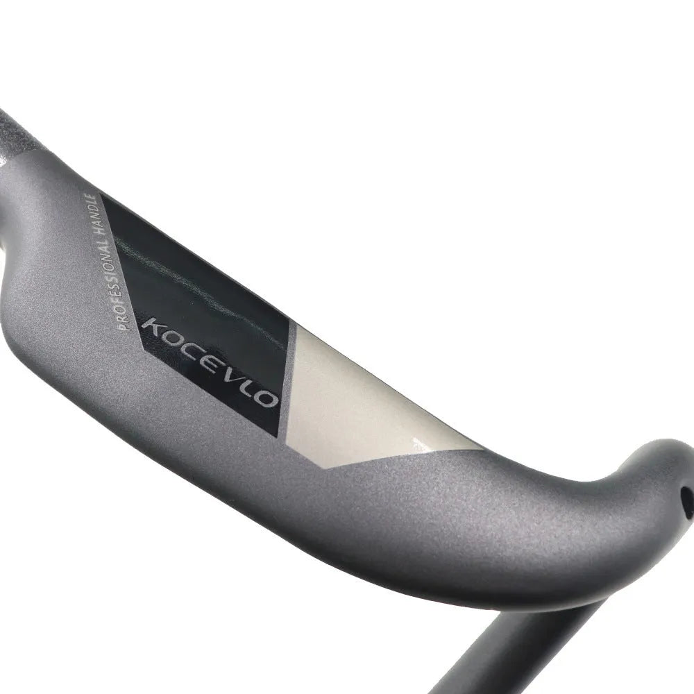 Matt carbon fibre road bicycle handlebar showing bent drop bar design