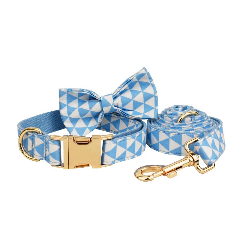 Blue four-piece dog set with collar, leash, bow, and vest in cloth material