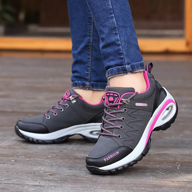 Low-top hiking and walking shoes in black with synthetic leather upper, mesh lining, and non-slip PU outsole.