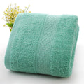 Thickened cotton blend bath and beach towel in apple green, dark blue, dark green, emerald green, light brown, or light pink.