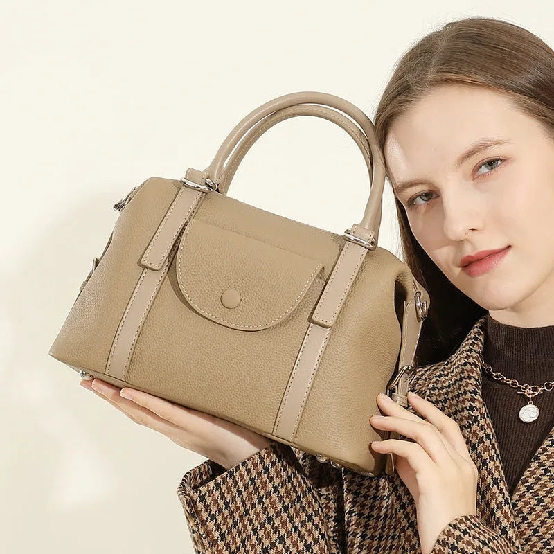 Genuine leather women's handbag in black, brown, or elephant grey with contrast stitching.