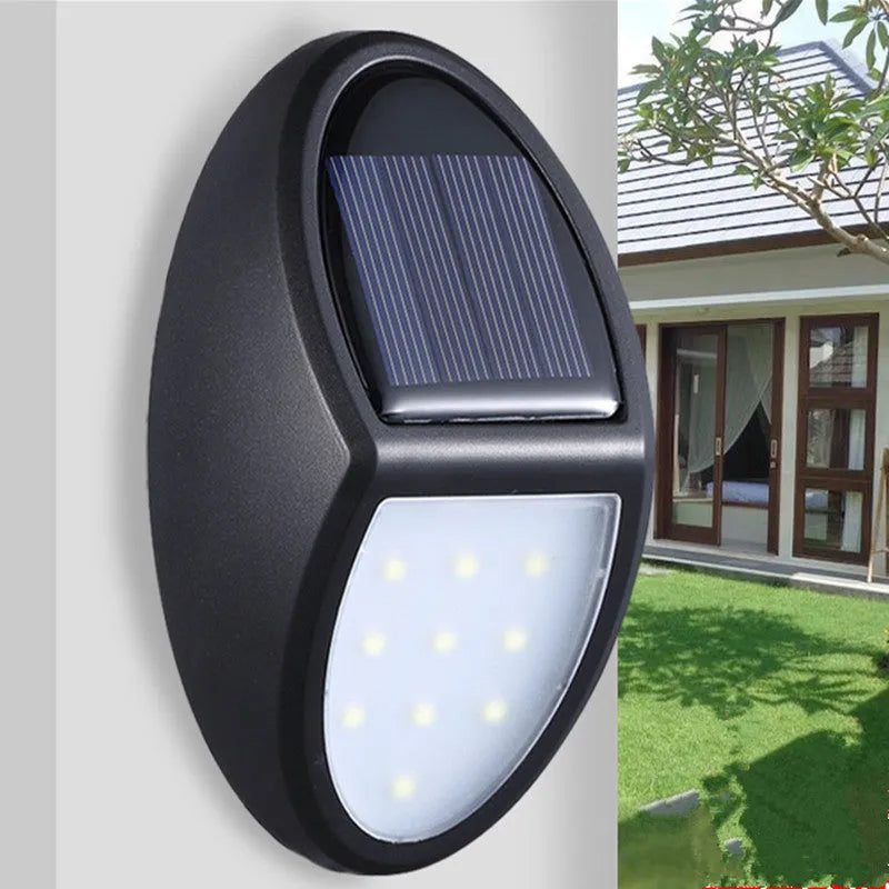 Black LED solar wall light with solar panel and automatic dusk-to-dawn sensor