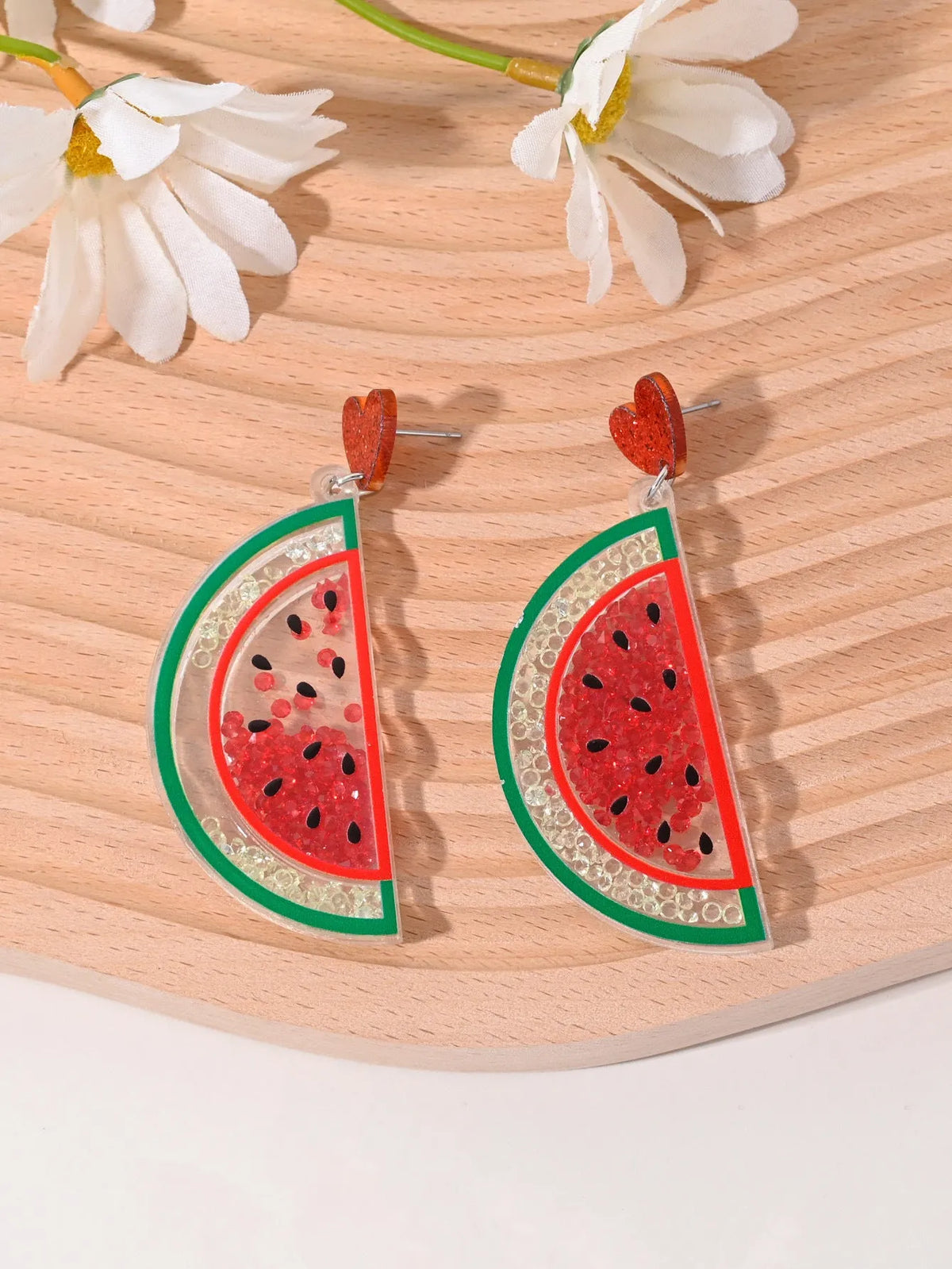 Set of acrylic earrings shaped like cherry, strawberry, watermelon, pineapple, coconut, cake, and ice cream.