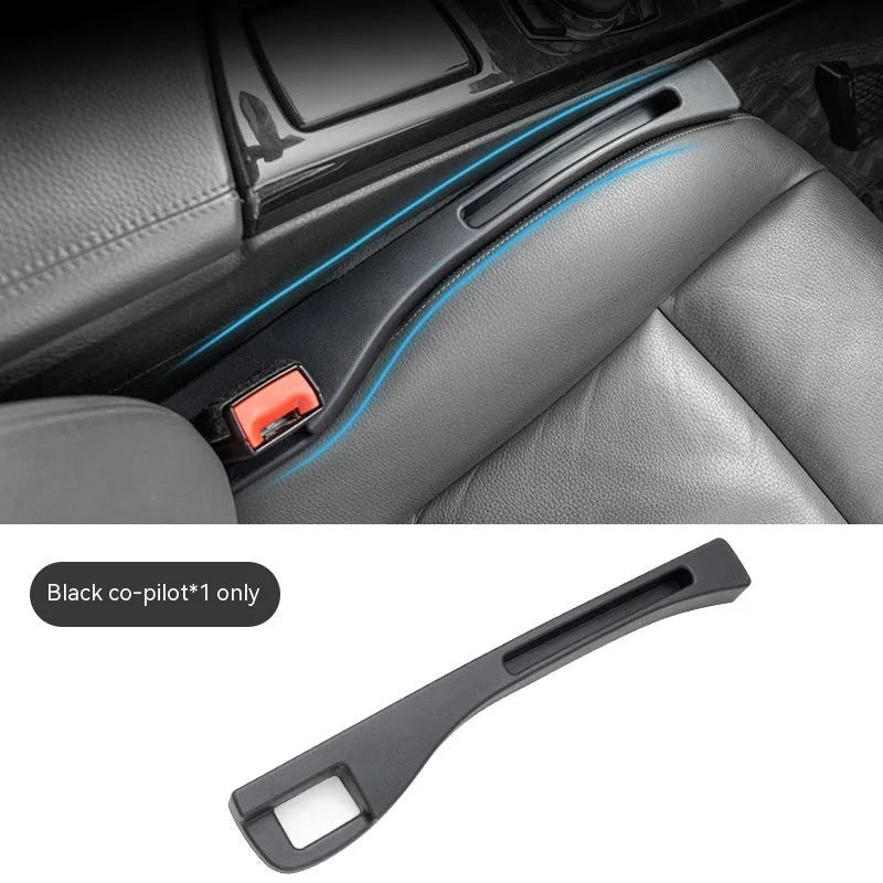 Black plastic car seat gap storage organiser box with a handle.
