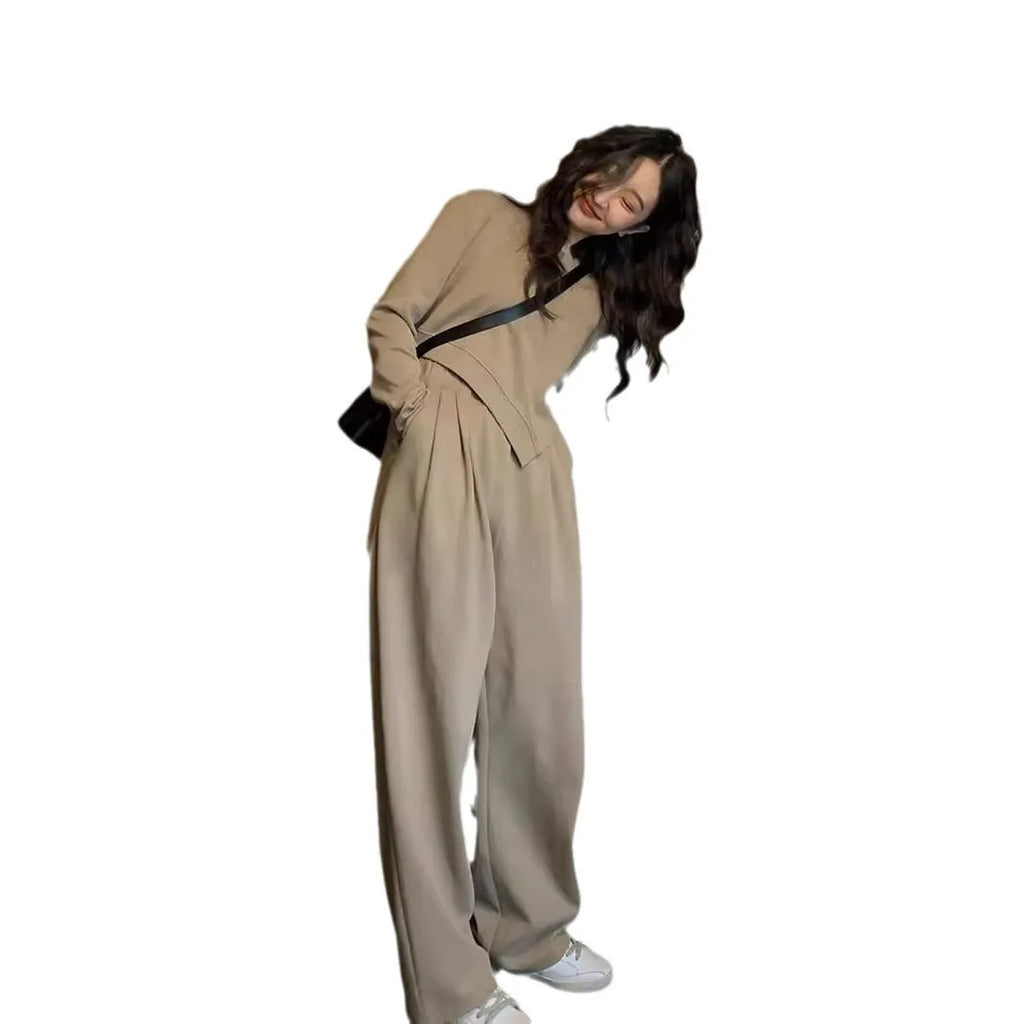 Women's khaki loose-fit casual sportswear set with long sleeve top and trousers on a hanger.