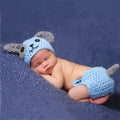 Hand-knitted cartoon animal newborn photography outfit in blended spandex, available in 19 animal designs for newborn photo sessions.