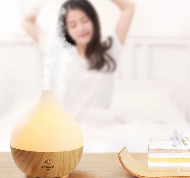 Asakusa wood grain vase-shaped aroma diffuser with USB cable on a wooden surface.