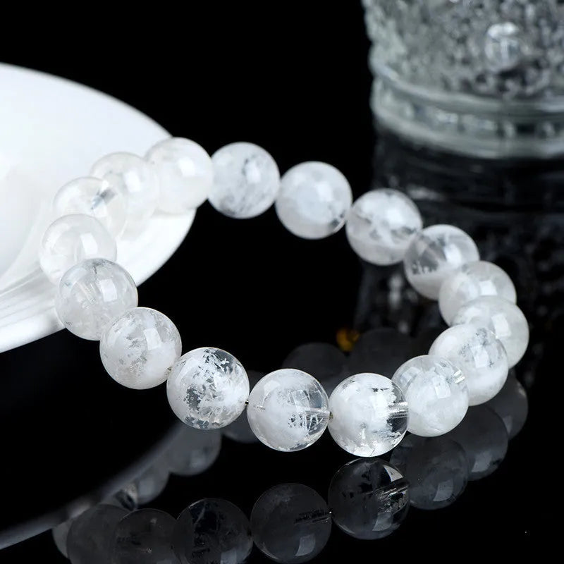 Women's crystal beaded bracelet with blizzard snowflake round beads and Ruyi Xiangyun design.
