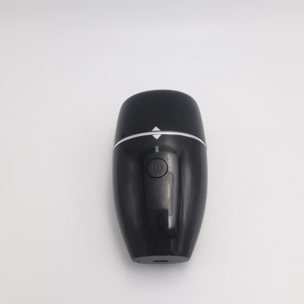 Black and white electric lip plumper device with silicone tip and USB charging cable