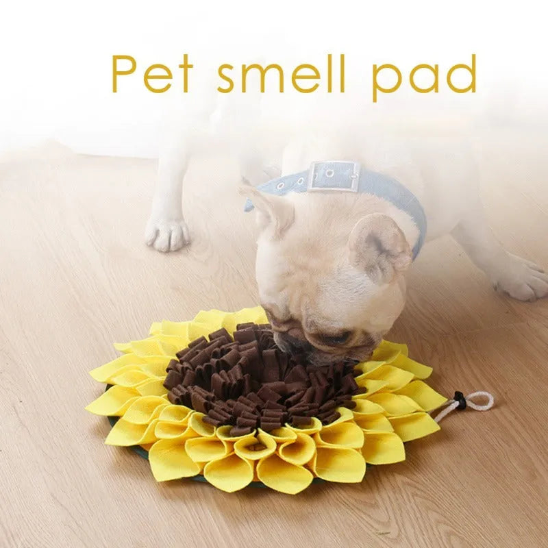 Yellow sunflower-shaped dog snuffle mat with rope and buckle for slow feeding and nosework training.