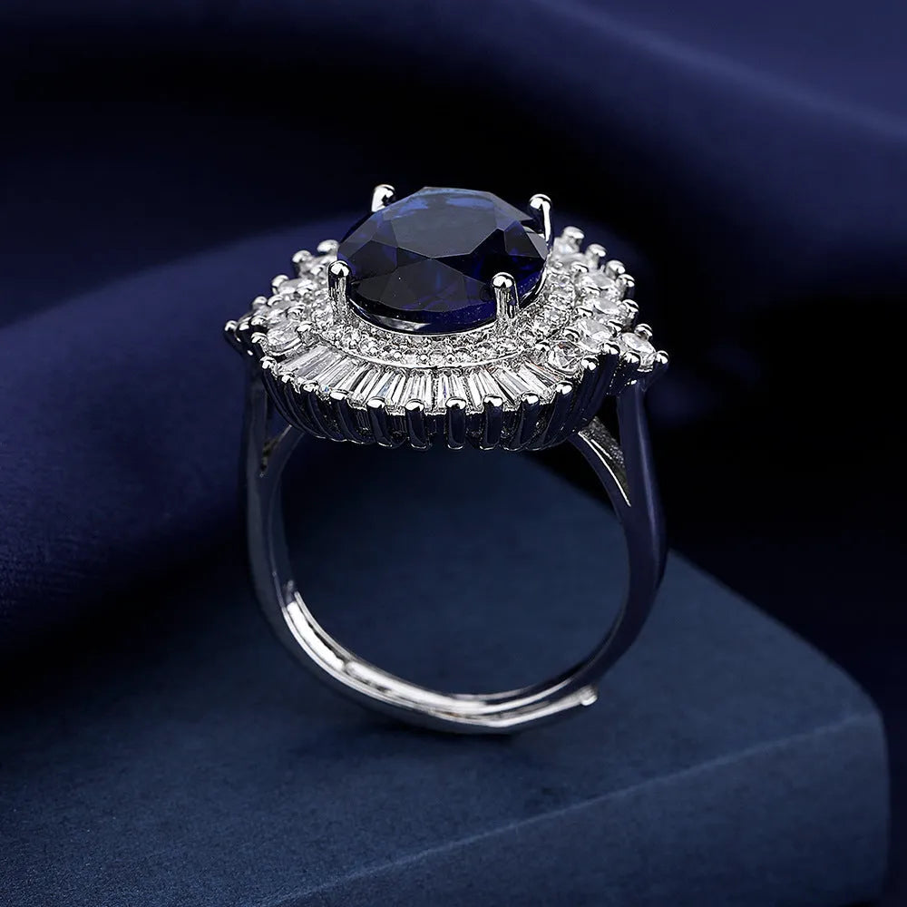 White gold colour copper crown shape ring with sea blue heart centrepiece and open mouth adjustable design