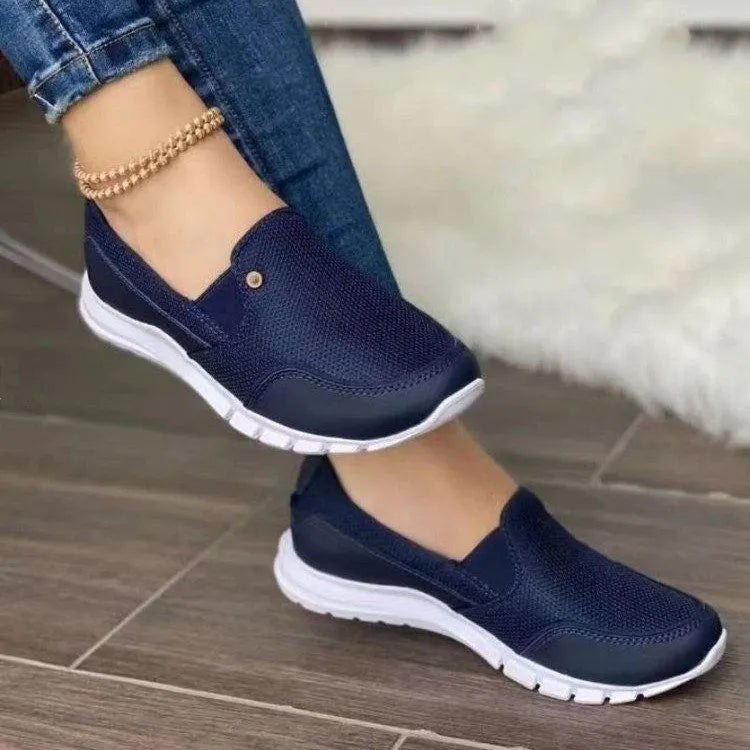 Canvas slip-on loafers for women flat heel round toe patent leather finish available in multiple colours
