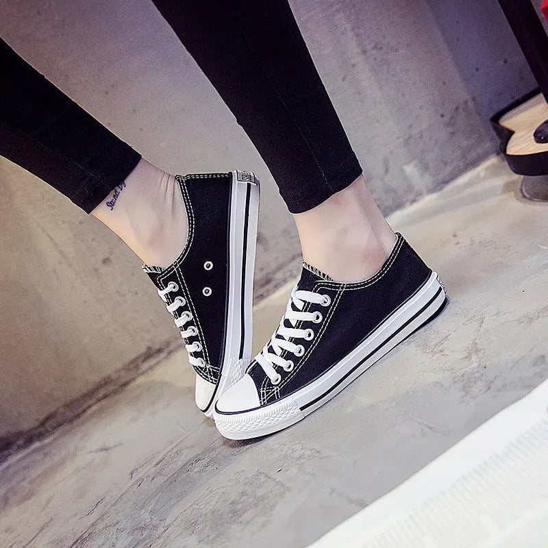 Women's solid colour canvas casual shoes in black, white black, white red and all black colour options.