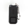 Small pink personal safety alarm with keyring, shown next to its white packaging box.