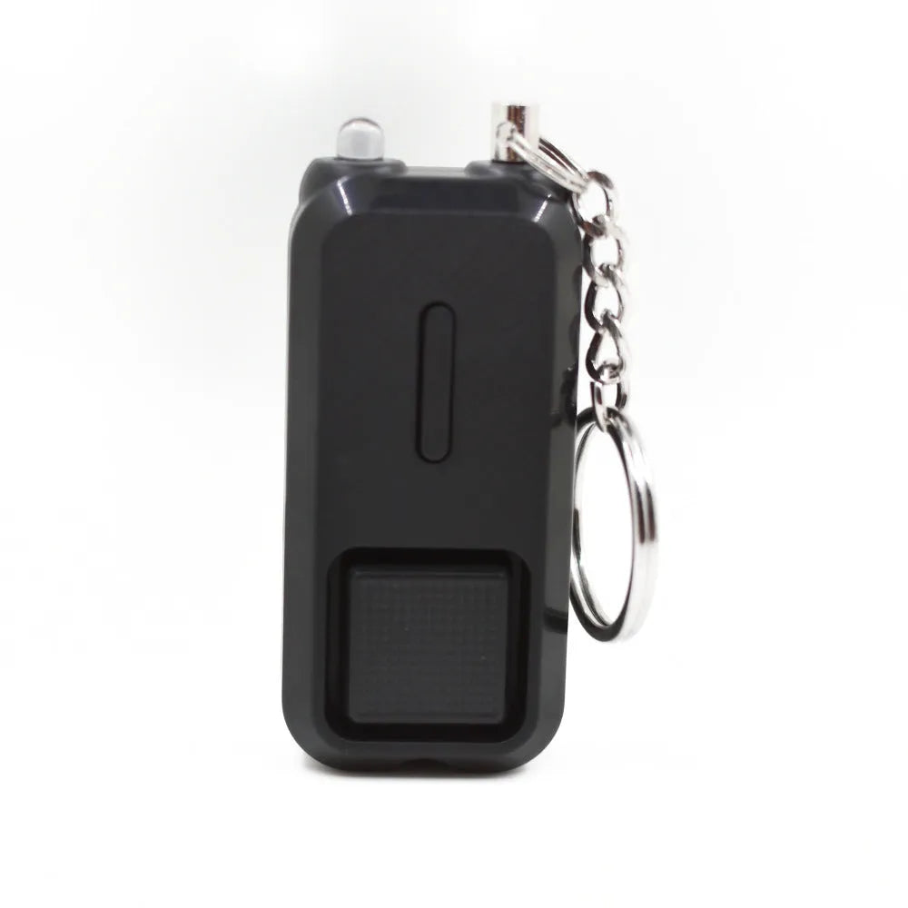 Small pink personal safety alarm with keyring, shown next to its white packaging box.